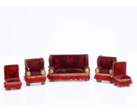 German dolls’ house upholstery set,  comprising a sofa —5in. (13cm.) wide and two armchairs with burgundy velvet, gilt metal 