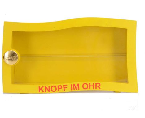 A Steiff yellow wooden wall display case, with metal gold Steiff button logo, perspex front, to display miniature bears —24in