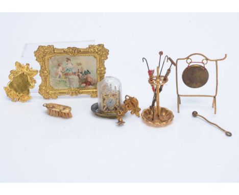 German gilt metal dolls’ house chattels,  a frame with picture of 18th century courting couple —3 ½in. (9cm.) wide; a stick s