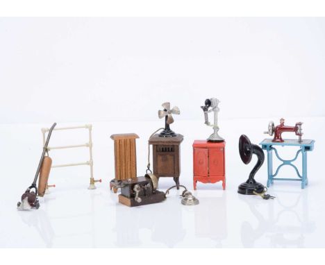 Dolls’ house technology, comprising a wooden wall mounted telephone with bell, a  Plank sewing machine —3in. (7.5cm.) high; a