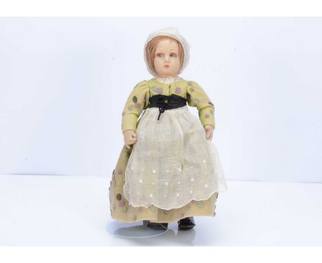 A Lenci felt girl dolls, 1930s, with pressed felt head, brown painted side glancing eyes, brown mohair wig, swivel head, join