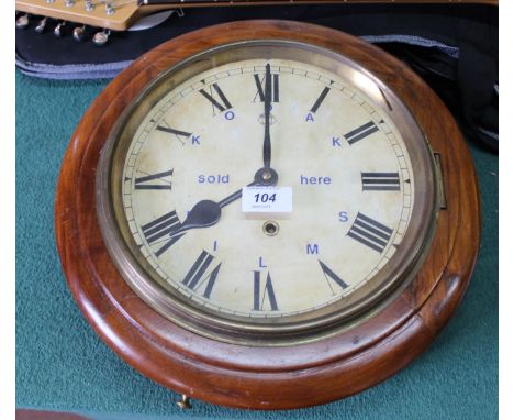 A circular mahogany dial clock with Kodak film advertising logo