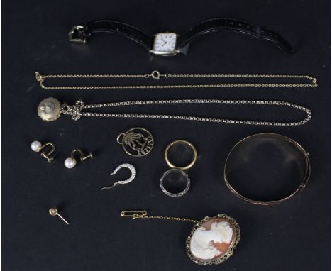 A ladies 9ct gold cased Tissot watch, a childs 9ct gold bangle plus other yellow metal items