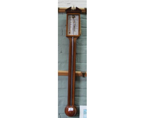 An inlaid mahogany stick barometer with parallel gauges