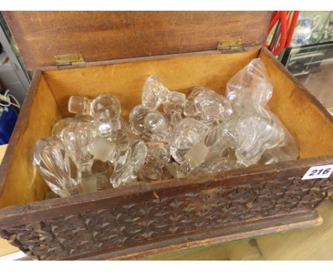 PINE CHIP CARVED BOX CONTAINING VARIOUS DECANTER STOPPERS