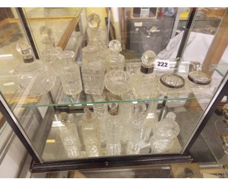 SHELF OF ASSORTED GLASS SCENT BOTTLES