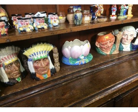 Four Royal Doulton Toby jugs and a Clarice Cliff bowl
