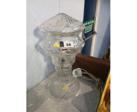 A cut glass lamp and shade