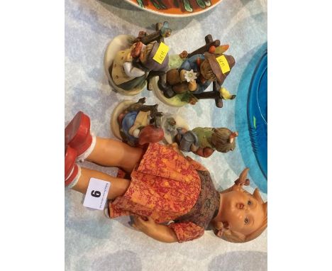 Four Goebel figures and a doll