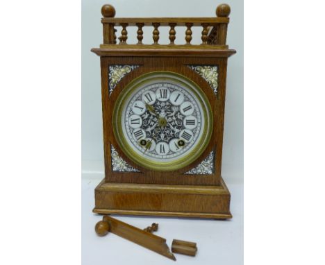A Victorian Aesthetic Movement oak mantel clock with gallery top, top a/f