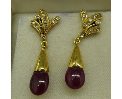 A pair of yellow metal set, ruby and diamond earrings