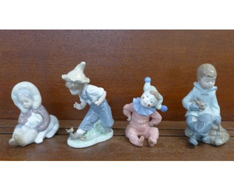 A Lladro figure of an Eskimo boy with polar bear cub and three Nao figures, a boy with rabbit, a clown and a boy with birds