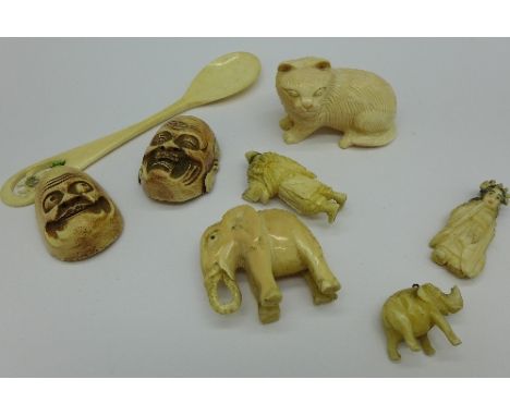 A carved ivory elephant, a carved bone spoon, a netsuke and other carved items