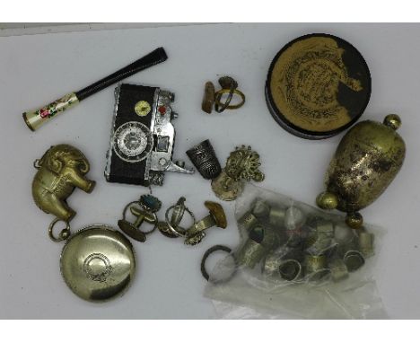 A novelty lighter in the form of a camera, a rattle, a silver Charles Horner thimble, jewellery, etc.