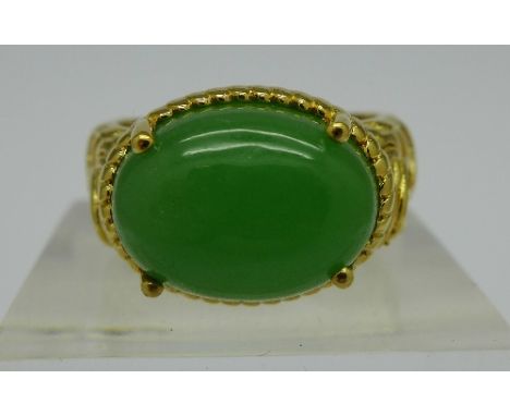 A silver gilt and jade ring, R