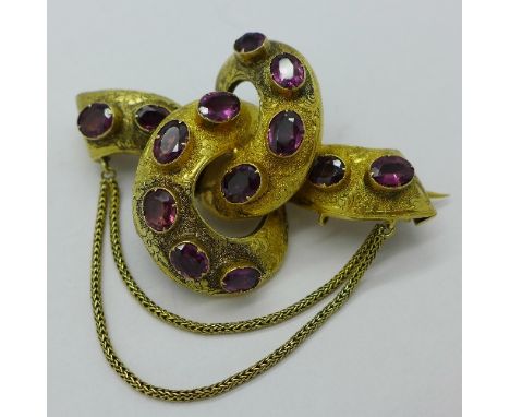 A Victorian yellow metal and amethyst brooch, 13.6g