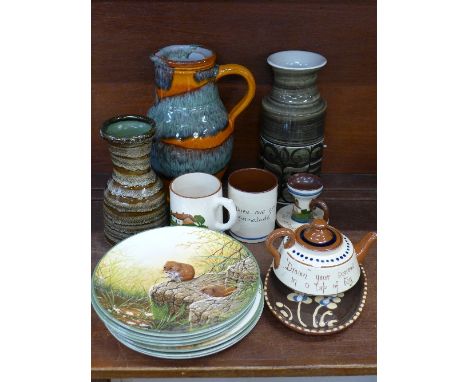 Studio pottery, seven Royal Doulton plates and Torquay pottery, candlestick and teapot a/f