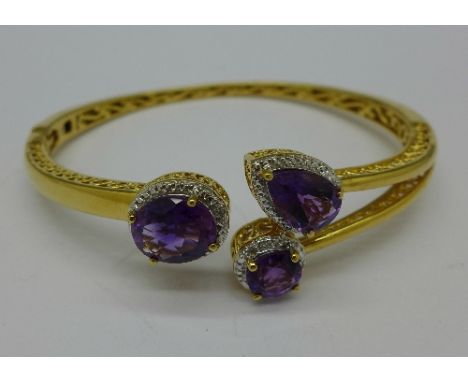 A silver gilt, amethyst and diamond bangle