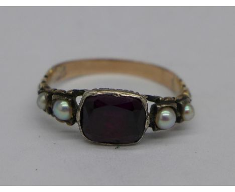 A 19th Century ring set with seed pearl and red stone, K