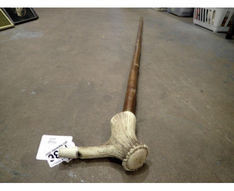 Tall walking stick with carved antler handle, L: 128 cm. Not available for in-house P&amp;P