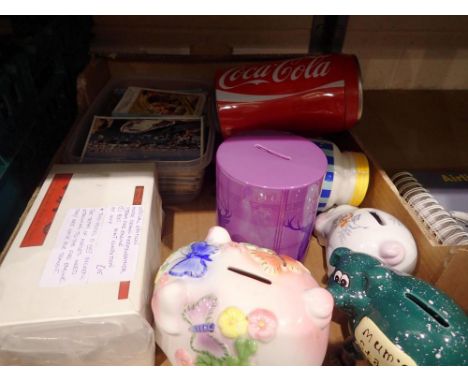 Mixed collectables, including six piggy banks, two framed pictures, postcards and a boxed diecast model. Not available for in