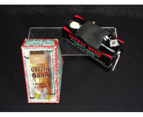 Yone - A boxed vintage Japanese tinplate Coffin Bank made by Yone. The item appears to be in Mint condition in an Excellent b