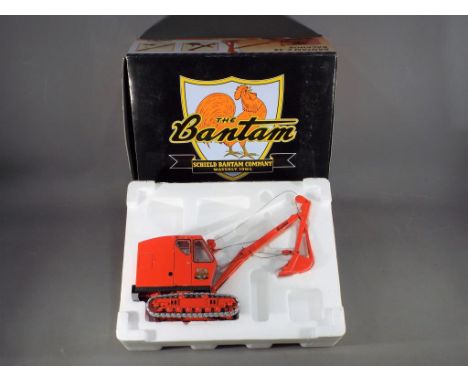 Schield Bantam - A boxed 1:25 scale Schield Bantam CON 003 Bantam C-35 Backhoe. The model constructed of metal appears to be 