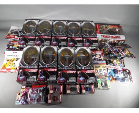 A mixed lot to include nine Saban's Power Rangers Alpha 5 figurines in factory sealed window boxes, a Transformers The Last L