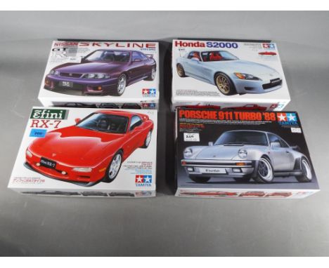 Tamiya Japan - four Tamiya Japan 1/24 sport car series model cars to include Efini RX-7, Nissa Skyline GT-R V-Spec, Porsche 9