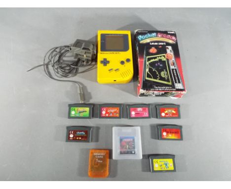 Nintendo - A Nintendo Game Boy hand held games console in yellow with eight Game Boy and Game Boy Advance game cartridges to 