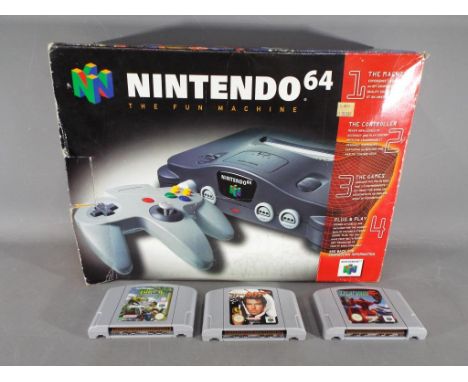 Nintendo - A boxed Nintendo N64 games console with controller and three game cartridges comprising Turok, Lylat Wars and Gold