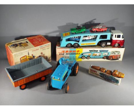 Tomiyama and others - Three boxed vintage Japanese and Chinese tinplate toys. Lot consists of a Happy Crocodile Wind Up toy; 