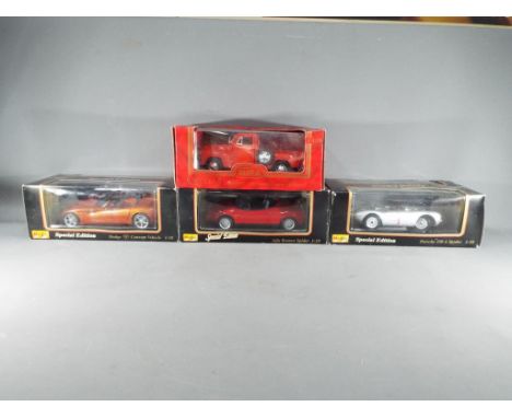 Four 1:18 scale diecast model motor vehicles to include three Maisto comprising Dodge Concept Vehicle, Alfa Romeo Spider, Por