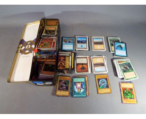 A tin containing a quantity of trading cards to include Magic the Gathering, Yu-Gi-Oh!, X-Men, Duel Masters and similar.
