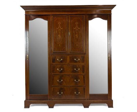 Edwardian inlaid Sheraton Revival Style Mahogany triple wardrobe. The central section of two doors inclosing a single shelf a