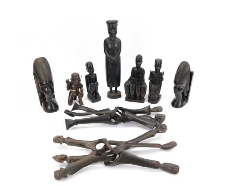 Mid 20th century carved African items, including pair of bookends, figure of a man, four tribal figures and two pot stands, m