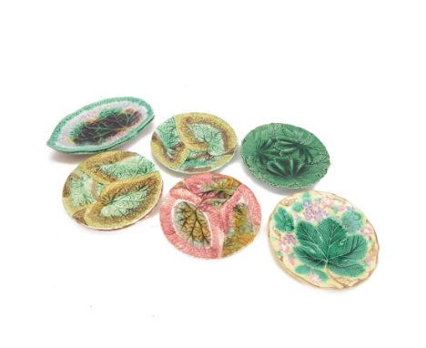 Eight 19th century and later Majolica desert plates, including two Wedgwood examples decorated with foliage 