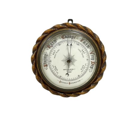 Mappin & Webb - early 20th century aneroid barometer with an 8” porcelain dial  and 11” rope twist oak carved bezel within a 