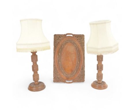 Pair of Kashmir carved hardwood table lamps, with cream fabric tassel shades, and a matching carved twin handled tray, lamps 