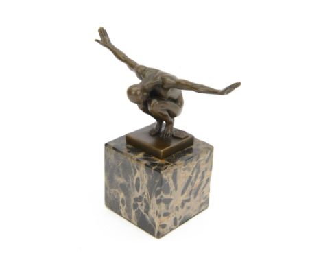 Bronze figure after Milo, a 'Power Of Silence', modelled as a male athlete crouched with arms outstretched upon a marble plin