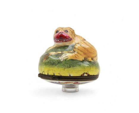 Rare 18th century Birmingham enamel bonbonniere, circa 1760, modelled as a grinning tiger laid upon a grassy sgraffito mound,