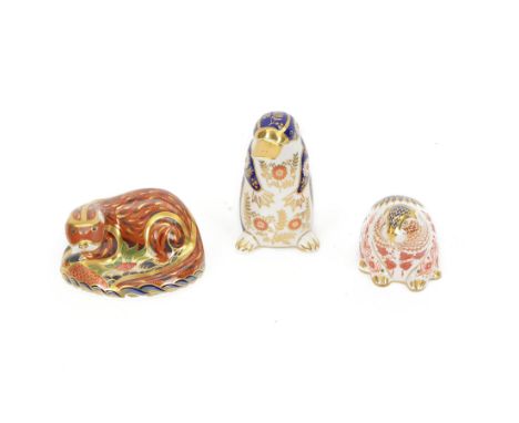 Three Royal Crown Derby paperweights, comprising Otter with gold stopper and box, Beaver with gold stopper and box and Platyp