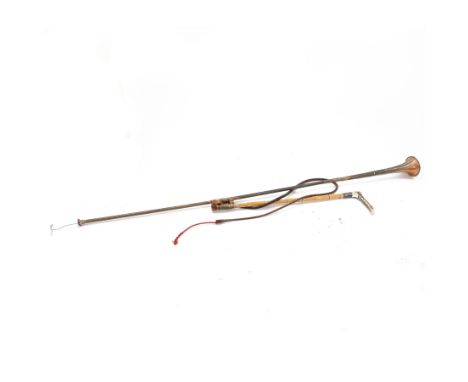 Bamboo cane hunting whip with horn handle, silver collar and leather strap, together with a copper coachman's horn, stamped L