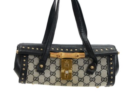 Gucci 'Bamboo Bullet' shoulder handbag, the canvas body with repetitive GG logo design and black studded leather border, with