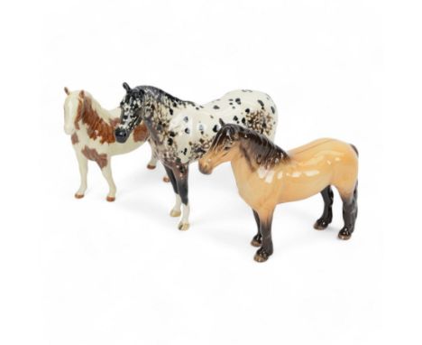 Three Beswick horse figures, comprising Appaloosa Stallion no 1772, Dunn Highland no 1644, and Skewbald Pinto no 1373