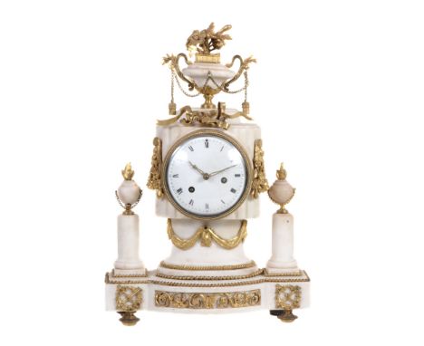 A French marble and ormolu mounted mantel clock, unsigned  A French marble and ormolu mounted mantel clock, unsigned,   first