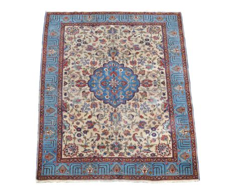 A Tabriz carpet, approximately 313 x 212cm  A Tabriz carpet,   approximately 313 x 212cm 