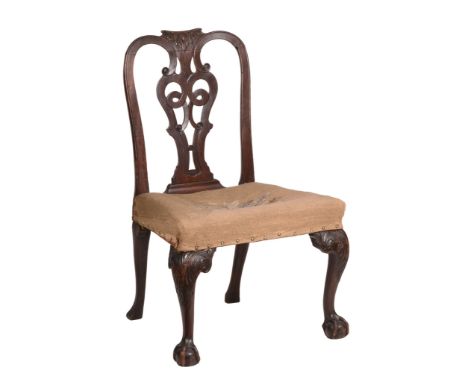 A George II mahogany side chair, circa 1750, the carved toprail above a decorative pierced splat, tapestry seat, and on cabri