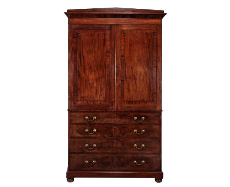A George IV mahogany clothes press , circa 1825  A George IV mahogany clothes press  , circa 1825, the caddy top above a pair