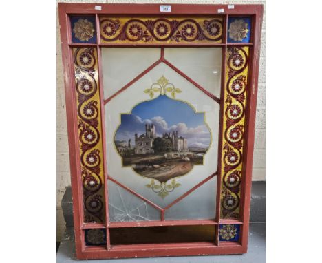19th century stained glass panel with architectural centre panel. 105x74cm approx. (B.P. 21% + VAT) The decorative panels to 